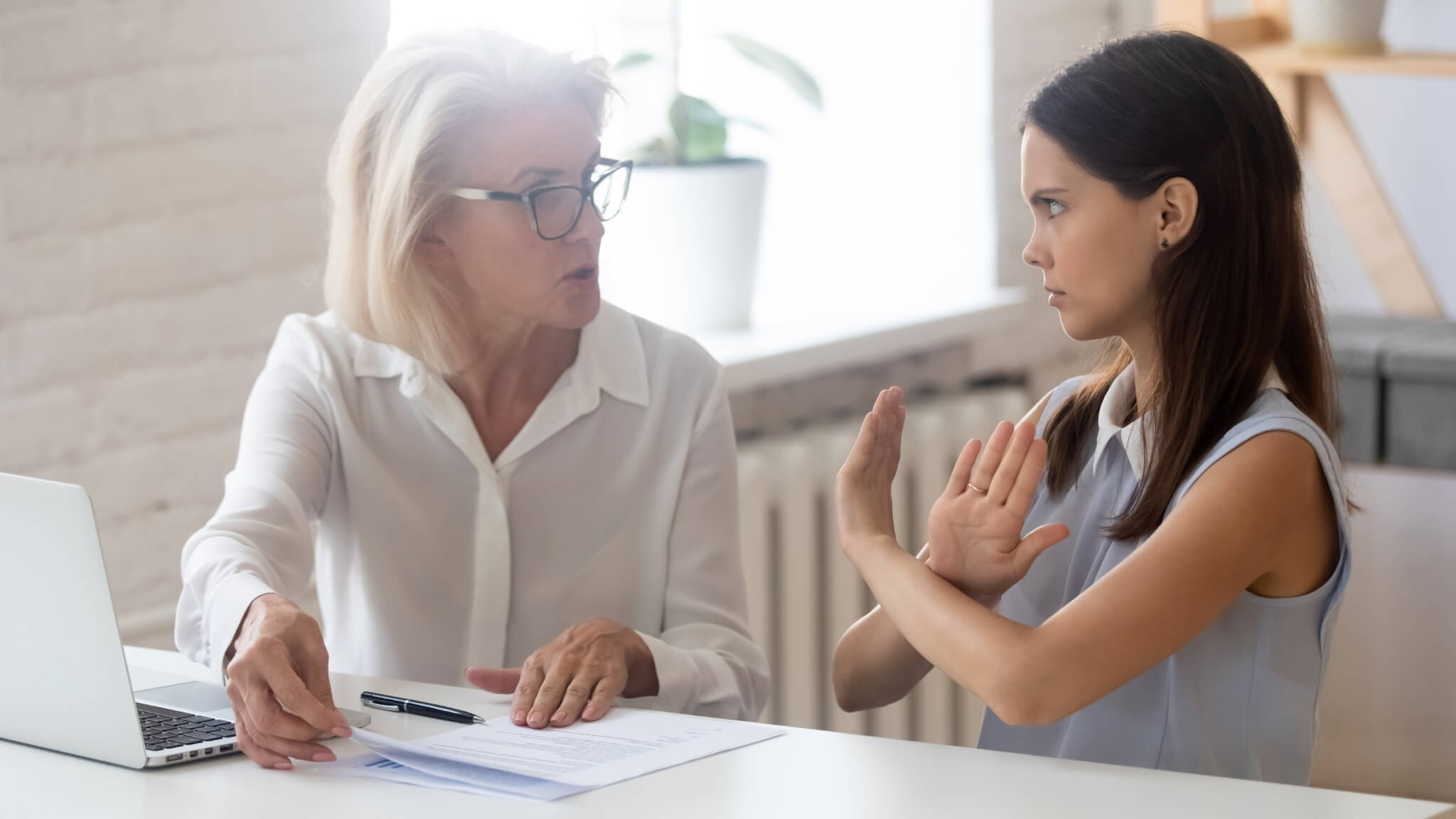 A lady ignoring negative feedback from her elderly client.