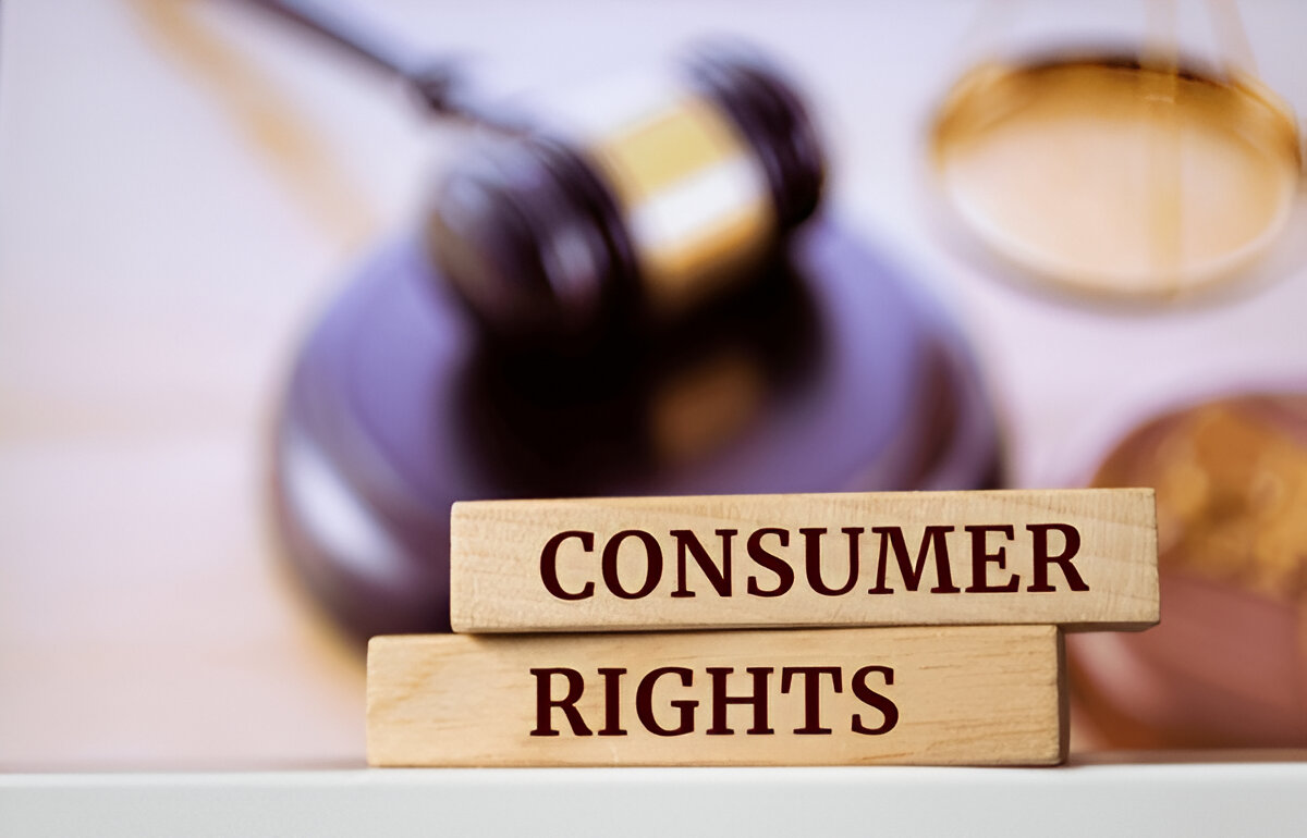A blurry gavel with CONSUMER RIGHTS inscribed on it