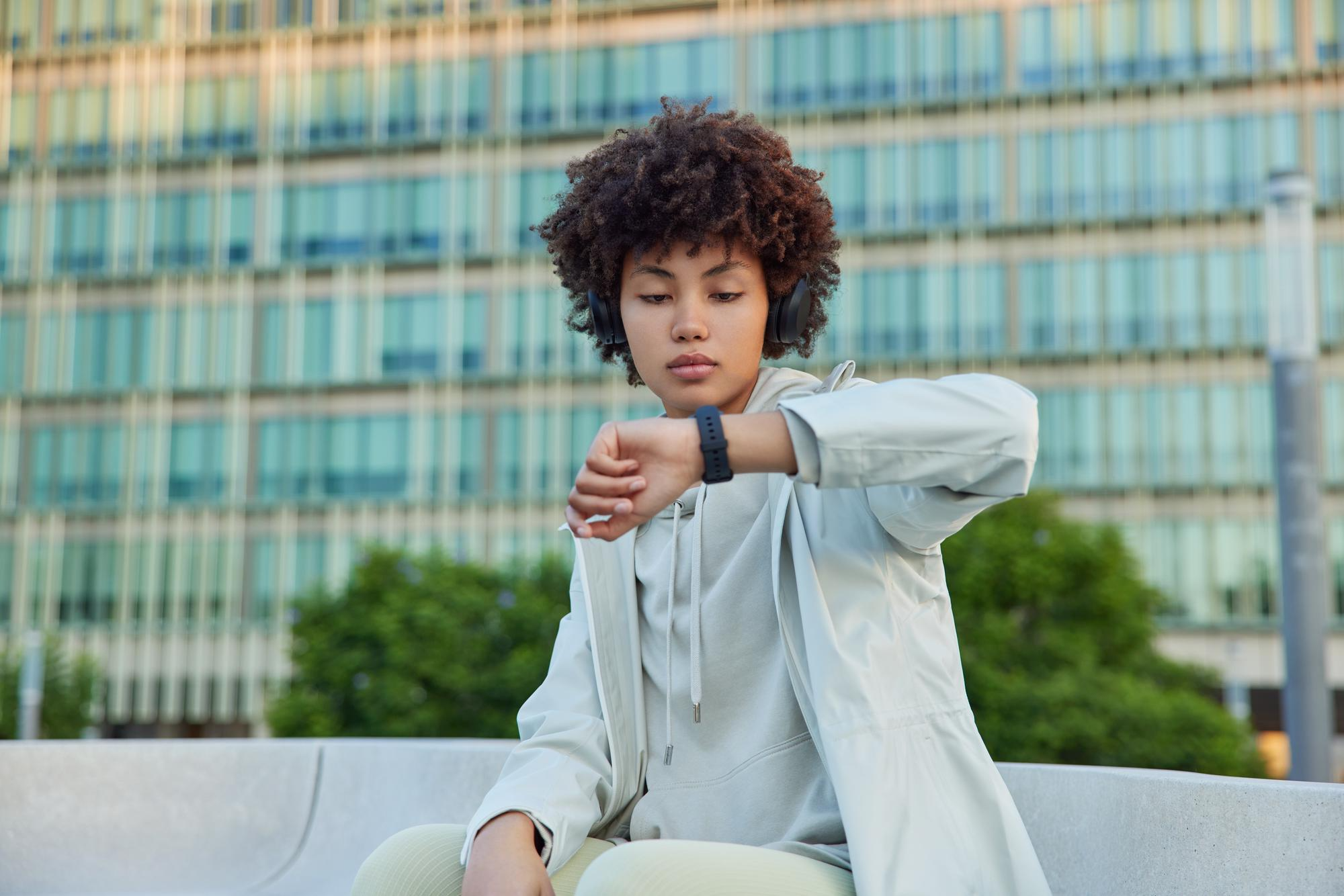 Lady checking the time via her wristwatch